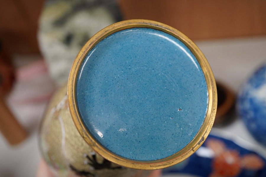 A Japanese Imari dish an Arita bottle vase together with a Chinese cloisonné enamel vase and a Chinese hardstone boulder carving, largest 34cm in diameter
